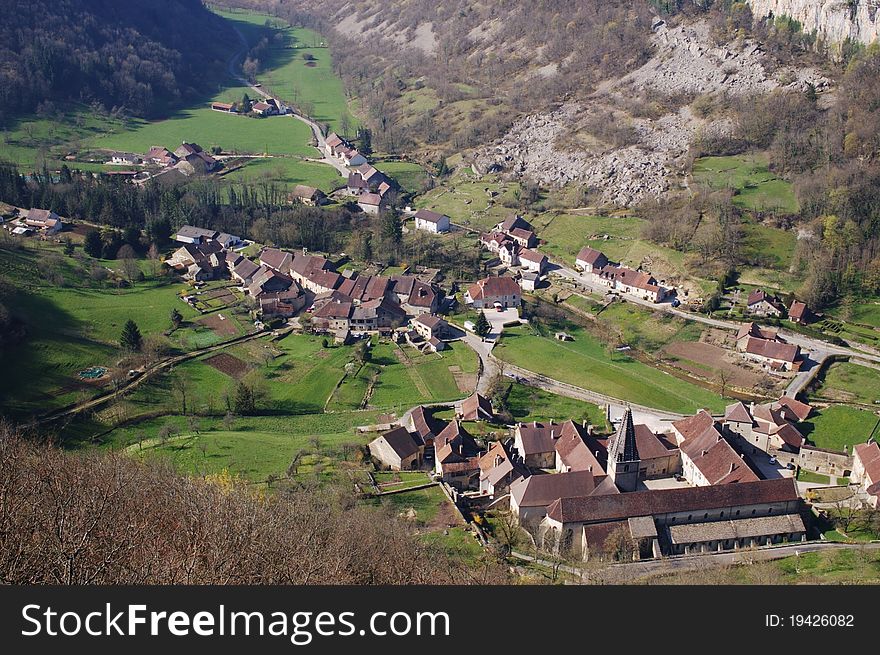 Panoramic view on old authentic french village and abbey in natural canyon. Cirque de Baume les Messieurs, France, Comte. Panoramic view on old authentic french village and abbey in natural canyon. Cirque de Baume les Messieurs, France, Comte