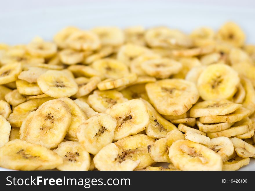 Dried banana slices on the white