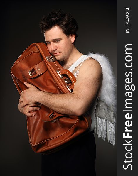 Mr. Angel with brown bag