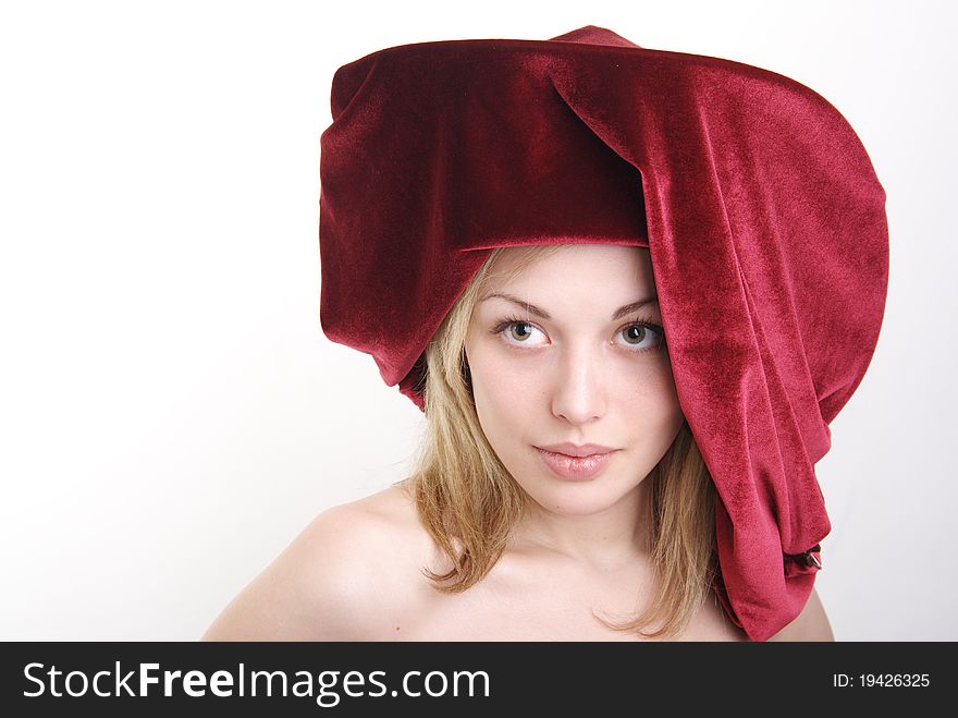 Portrait of the girl of the blonde in a hat. Studio.