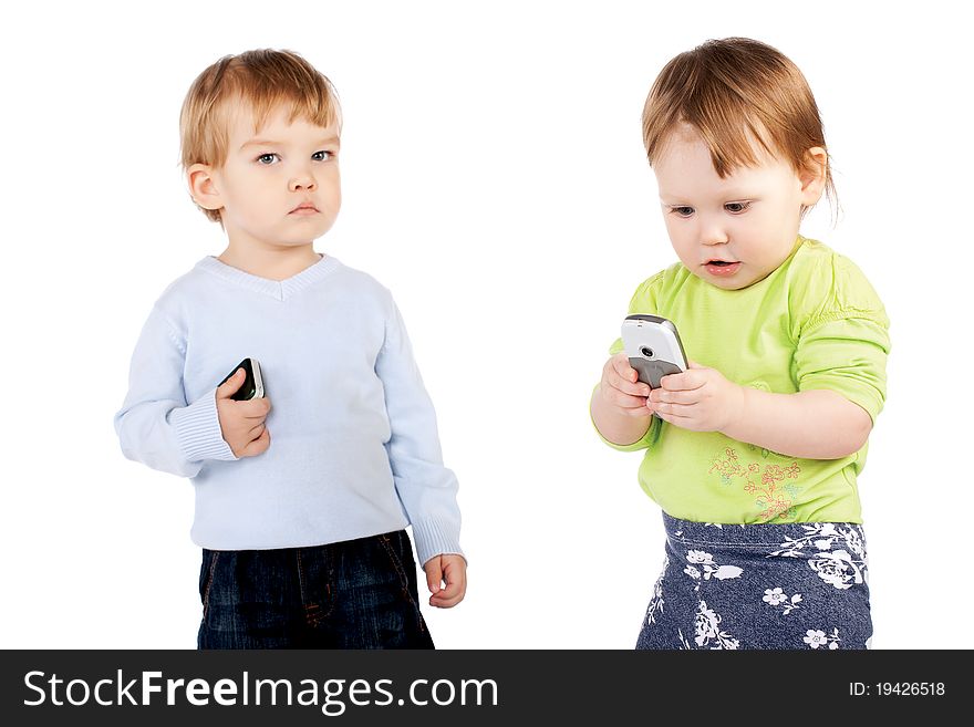 Isolated surprised little girl and boy the phone