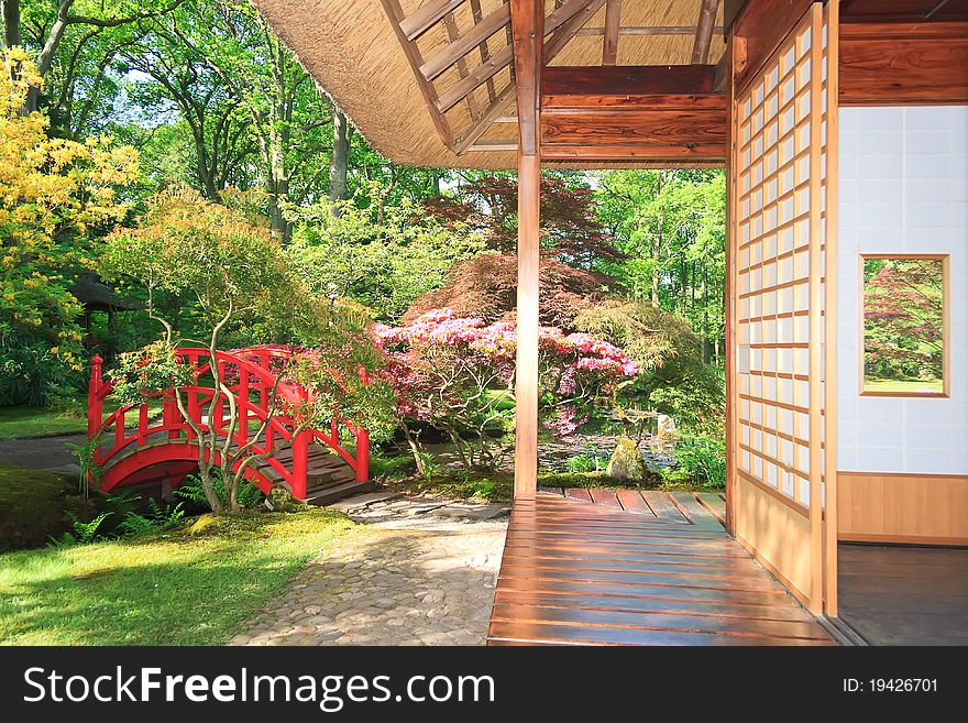 Red Bridge behind the little Japanese house in the park of clingendael, the hague, netherlands. Red Bridge behind the little Japanese house in the park of clingendael, the hague, netherlands