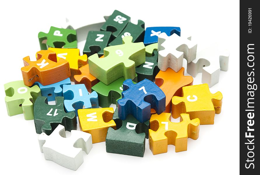 Heap of wooden puzzle blocks