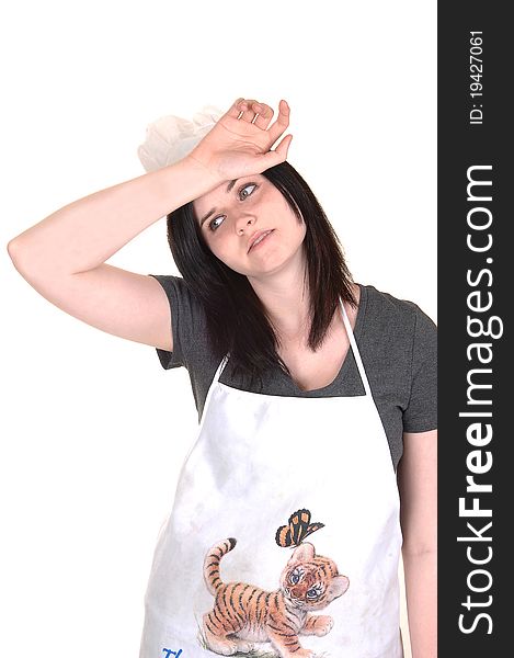 The picture of an exhausted young woman with an apron and a cooking hat, wishing the sweat from her forehead, on white background. The picture of an exhausted young woman with an apron and a cooking hat, wishing the sweat from her forehead, on white background.