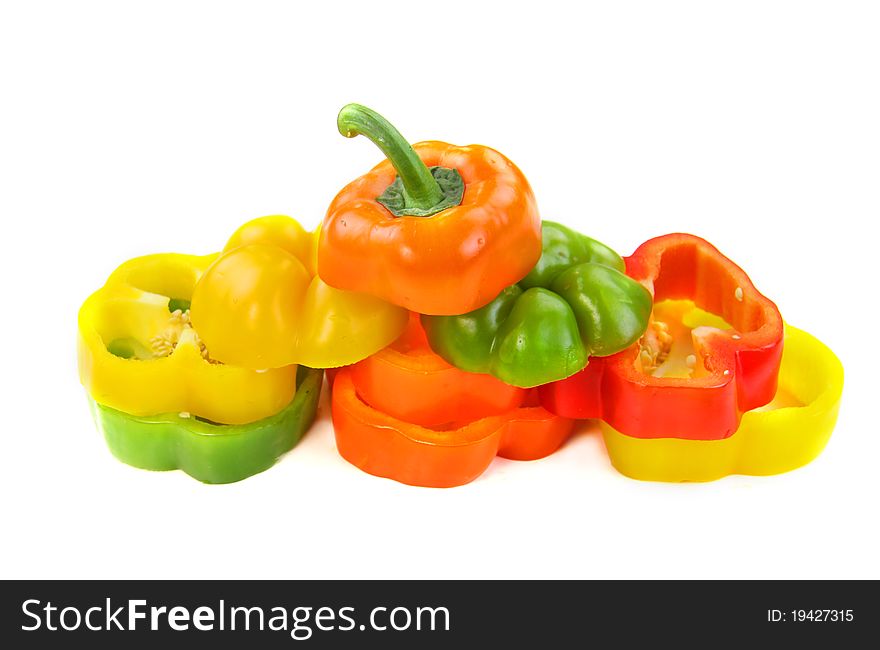 Cut colorful pepper slices on white background. Cut colorful pepper slices on white background