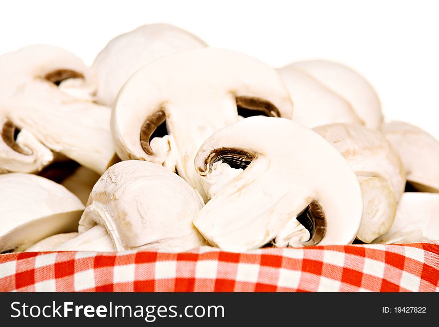 Basket full of champignon mushrooms, isolated on white