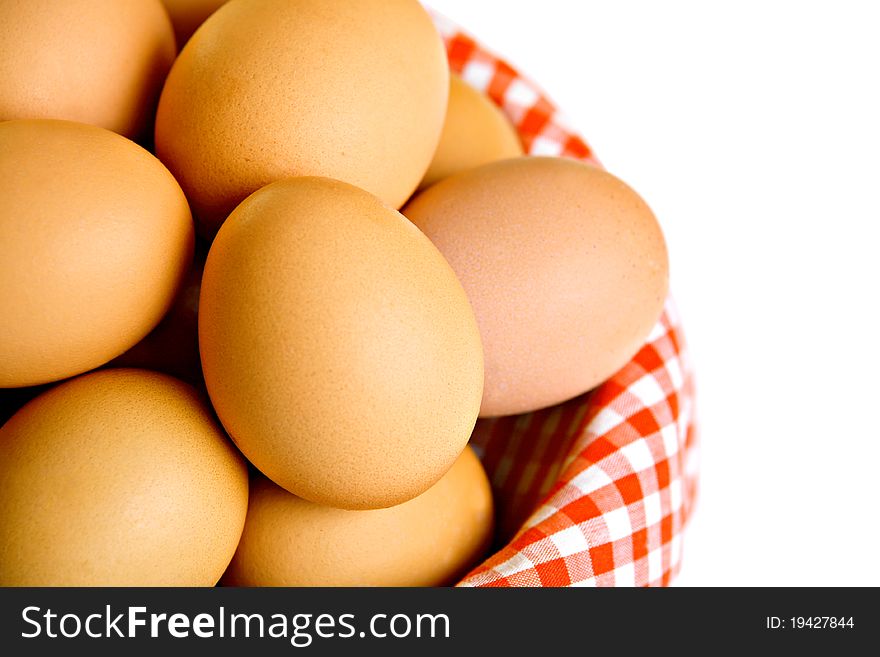 Basket full of eggs, isolated on white
