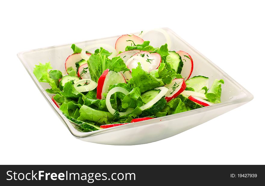 Fresh vegetable salad in a plate over white