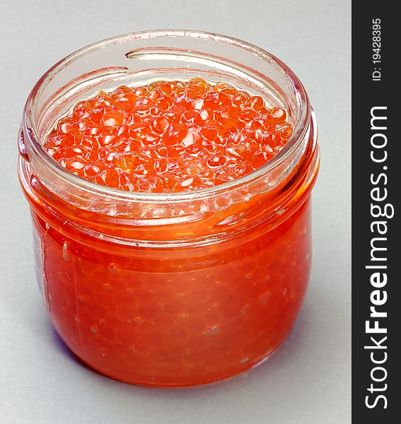 Delicacy. Canned. Red caviar in a glass jar. Delicacy. Canned. Red caviar in a glass jar.