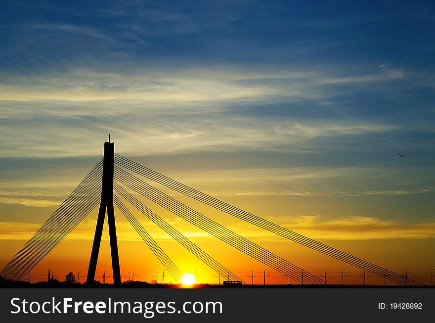 Sunset bridge river Daugava Riga