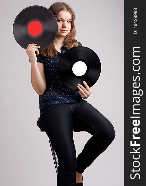 Girl with two musical records in the hands of