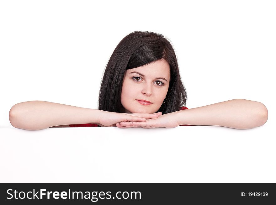 Portrait of a beautiful young woman with blank billboard on white background