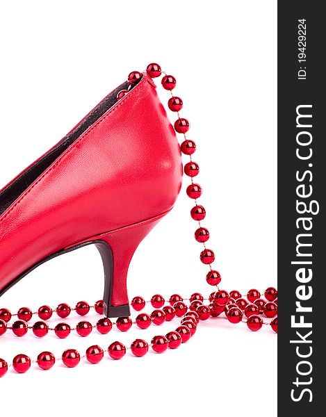 Part of red shoe with pearls