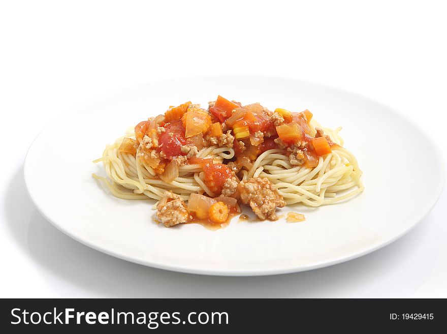 Spaghetti bolognese on dish isolated in white background