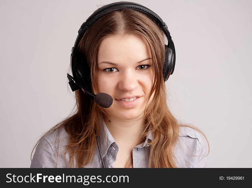 The girl in headphones with microphone