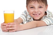 Boy With A Glass Of Juice Royalty Free Stock Photos