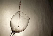 Single Wine Drop Splashes Into Glass Royalty Free Stock Photo