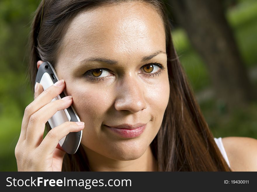 Beautiful young girl talking on the phone