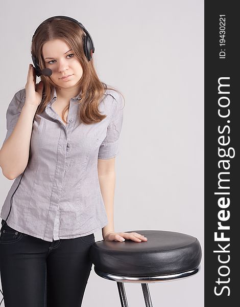 The girl in headphones with microphone