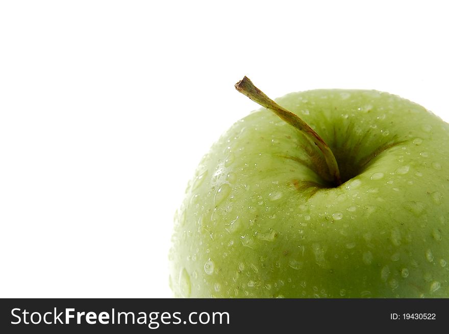 Detail photo of green apple isolated on white background, water drops