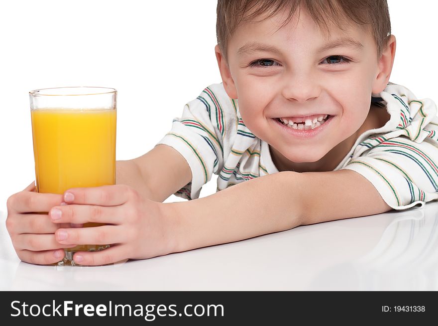 Little boy having a glass of refreshing oranges juice - isolated on white. Little boy having a glass of refreshing oranges juice - isolated on white