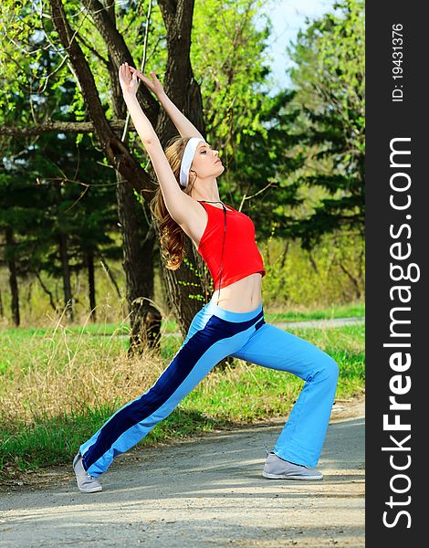 Young sporty woman is working out outdoor. Young sporty woman is working out outdoor.