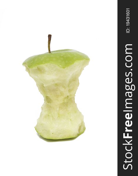 A eaten green apple isolated on a white background.