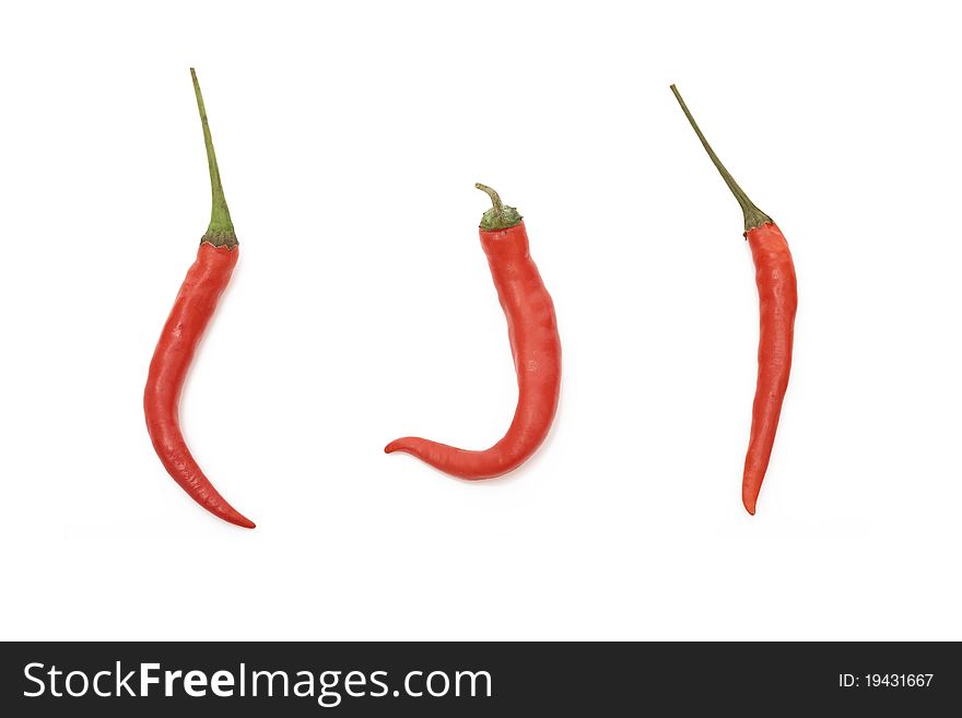 Three Thai peppers isolated on a clean white background.