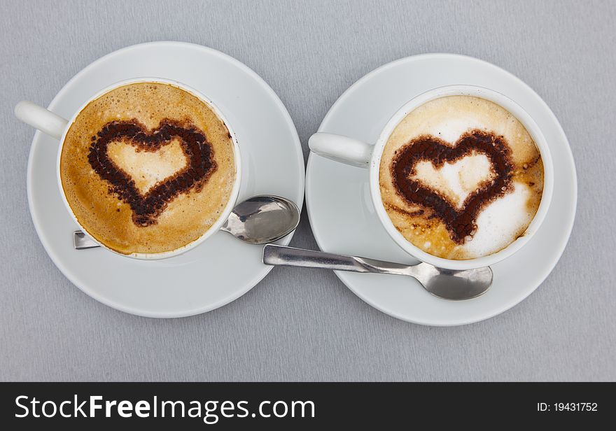 Two Cups of cappuccino with heart. Two Cups of cappuccino with heart