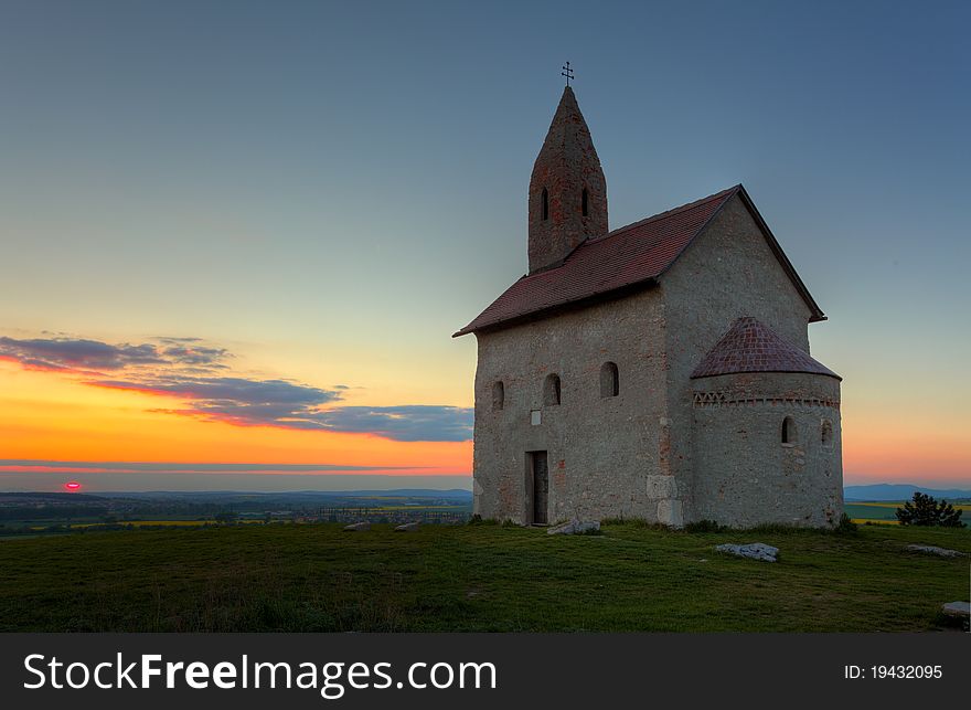 Nice Catholic Church In At Sunset.