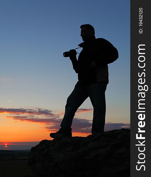 Photographer's silhouette at nice sunset. Photographer's silhouette at nice sunset.