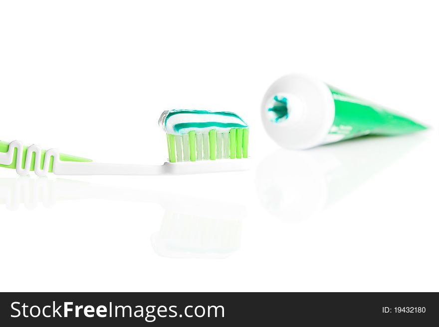 Macro shot of toothbrush with dental paste. isolated on white background