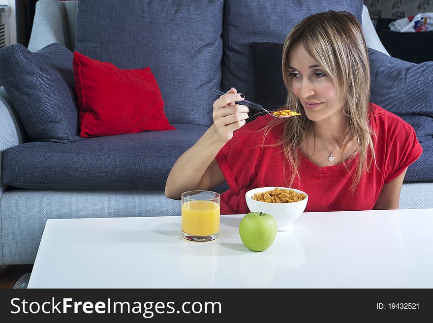 Beautiful blond woman having a healthy breakfast. Beautiful blond woman having a healthy breakfast