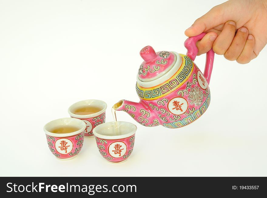 Chinese Tea Serving By Filling Up The Tea Cups. Chinese Tea Serving By Filling Up The Tea Cups