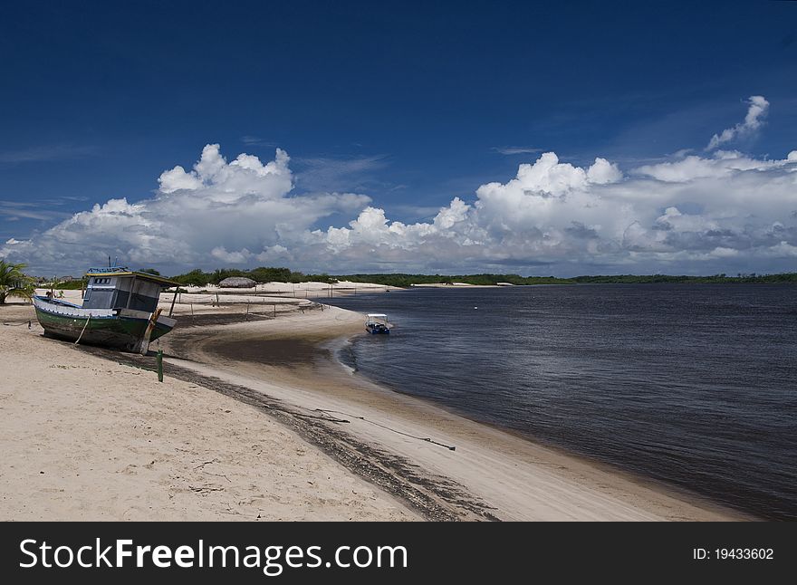 The CaburÃƒÂ© beach in Barreirinhas town, at the PreguiÃƒÂ§a river mouth, MaranhÃƒÂ£o State, Brazil. A wild and small sand strip between the beach and the river. 02Ã‚Â° 34' 37 S 42Ã‚Â° 41' 55 W. The CaburÃƒÂ© beach in Barreirinhas town, at the PreguiÃƒÂ§a river mouth, MaranhÃƒÂ£o State, Brazil. A wild and small sand strip between the beach and the river. 02Ã‚Â° 34' 37 S 42Ã‚Â° 41' 55 W