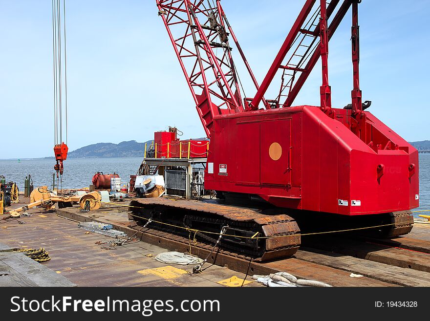 A heavy duty crane on a barge in Astoria Oregon. A heavy duty crane on a barge in Astoria Oregon.