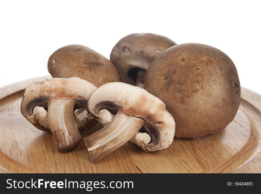 Fresh Baby Portobello Mushrooms on Cutting Board