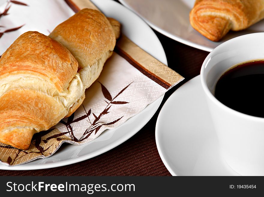 Fresh croissants with cup of coffee. Fresh croissants with cup of coffee