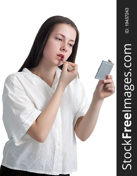 A young girl with her hair applying lipstick isolated on white background