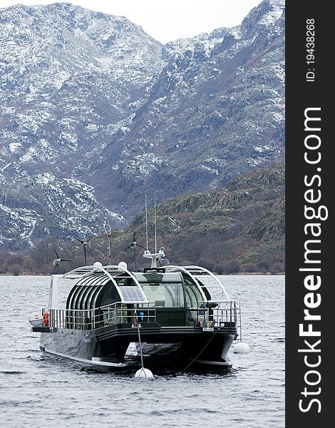 Anchored scenic boat at Spain's Sanabria lake. Anchored scenic boat at Spain's Sanabria lake