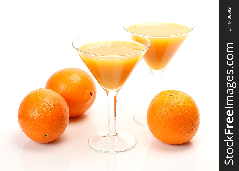 Fresh fruit and juice on a white background