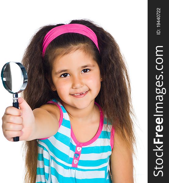 Beautiful little girl looking through a magnifying glass. Beautiful little girl looking through a magnifying glass