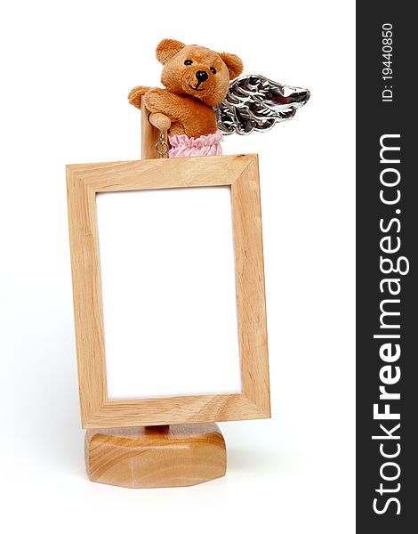 Frame of picture has teddy bear. Frame of picture has teddy bear