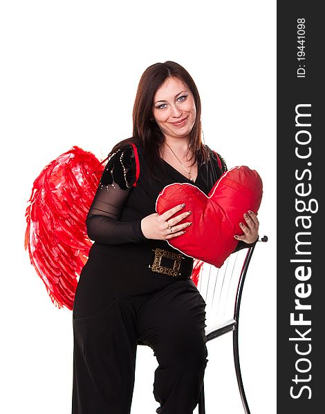 Beautiful woman with red heart in red angel wings isolated on white