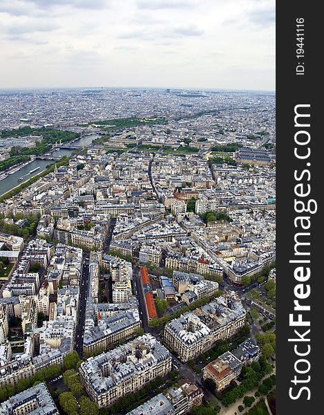 Center of Paris from the heights. The roofs of modern houses and streets. Urban scene.
