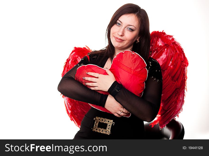Beautiful woman with red heart in red angel wings