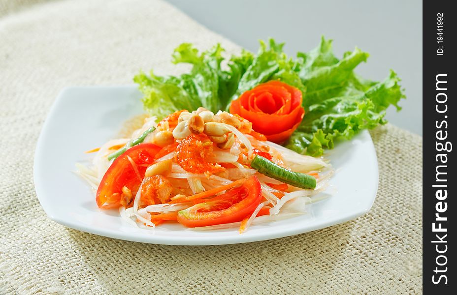 Papaya salad thai style one of Thai favorite spicy menu that you could find in everywhere in Thailand, an image isolated on white. Papaya salad thai style one of Thai favorite spicy menu that you could find in everywhere in Thailand, an image isolated on white