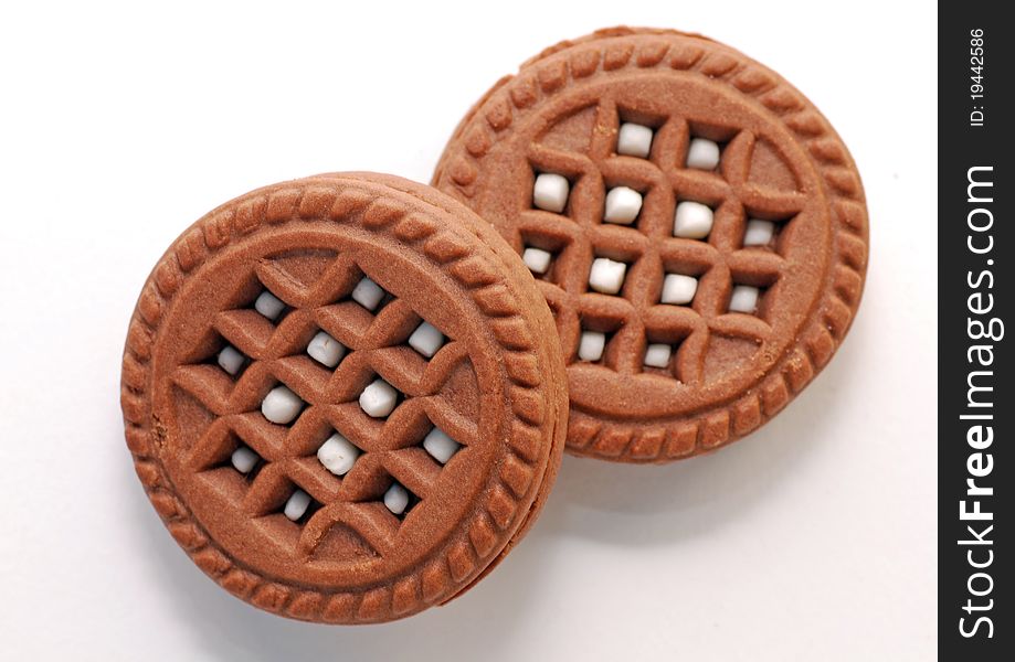 Brown sweet cookies on white background