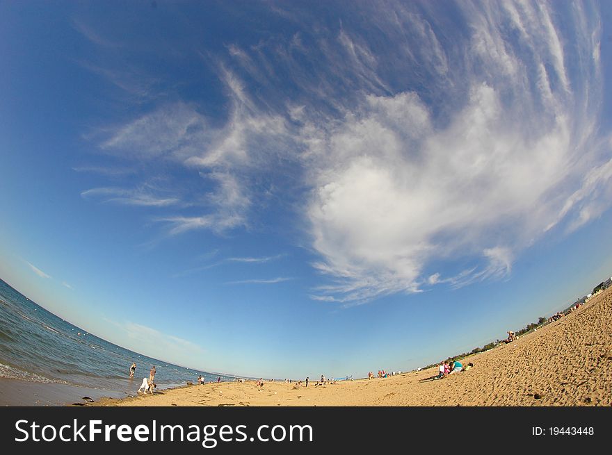 Golden beach and breathtaking sky with gorgeous clouds on a sunny day in Normandy, France. Golden beach and breathtaking sky with gorgeous clouds on a sunny day in Normandy, France