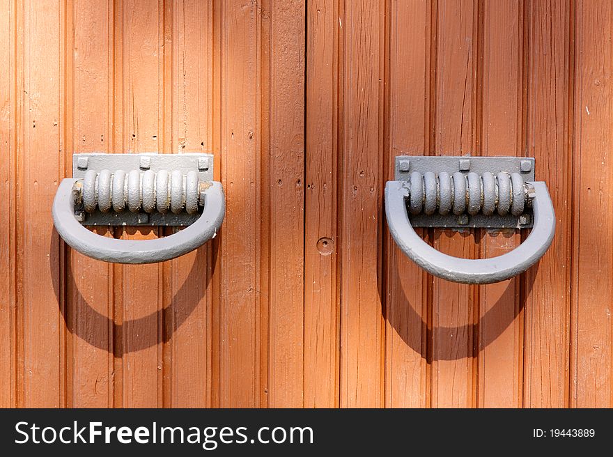 Cast-iron knobs of the old red wooden gates. Cast-iron knobs of the old red wooden gates.